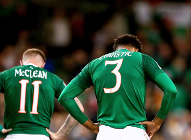 Ireland's James McClean and Cyrus Christie dejected at the final whistle.