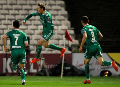 Sadlier (centre) celebrating a goal (file photo).