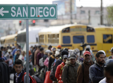 Central American migrants line up for a meal at a shelter in Tijuana, Mexico near the border with California