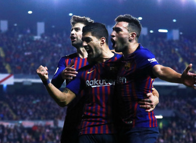 Barca celebrate Suarez's late strike.