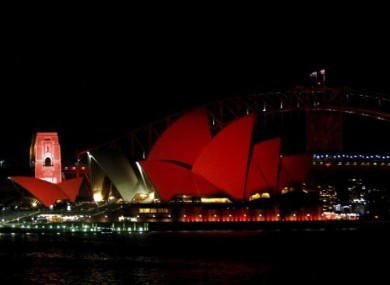 Sydney Opera House is bathed in red to launch World Aids Day.