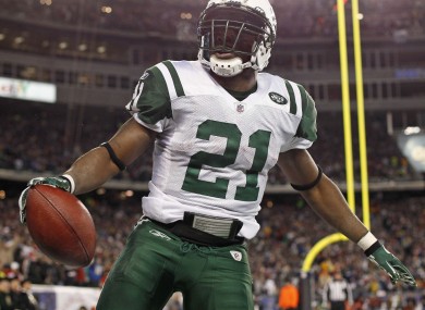 New York Jets running back LaDainian Tomlinson celebrates his touchdown against the New England Patriots.