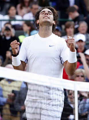 Spain's Rafael Nadal celebrates victory against USA's Mardy Fish in their quater-final match