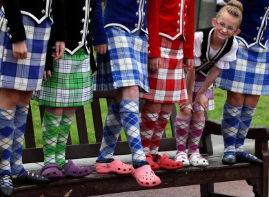 Seven year-old Amy Laughlin from the Mary Ann-Mcreadie Dance school in Paisley with dancers as they show off their traditional costume in Glasgow, before they join six bands competing in this weekend's World Pipe Band Championship.