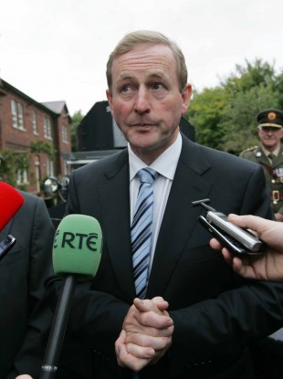 Taoiseach Enda Kenny answers questions about the Vatican response to the Cloyne report at the Curragh, in Co Kildare today.