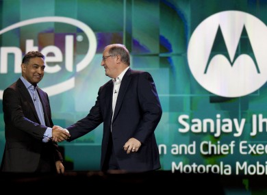 Sanjay Jha, chairman and CEO of Motorola Mobility, left, is greeted by Intel president and CEO Paul Otellini at 2012 International Consumer Electronics Show