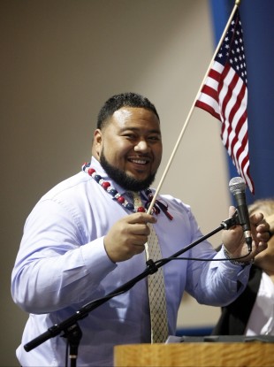 Deuce Lutui, from Tonga, being sworn in as a U.S citizen during a naturalization ceremony in 2010.