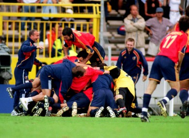 The Spanish players celebrate progression from the group stages.