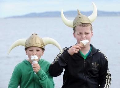 Carl Scully (11) and Connell Molloy (12), both from Clontarf, enjoy the Viking Festival today on the promenade.