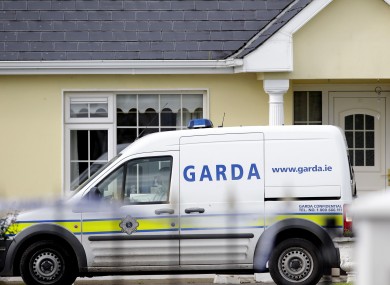Gardai outside the house in Harrison Place, Charleville, Co Cork on Monday.
