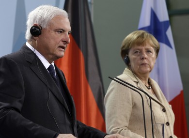German Chancellor Angela Merkel, right, and the President of Panama, Ricardo Martinelli, left, address the media during a joint press conference.