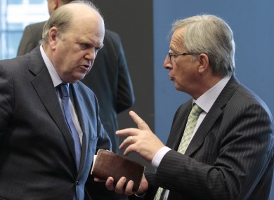 Michael Noonan speaks to Eurogroup president Jean-Claude Juncker before