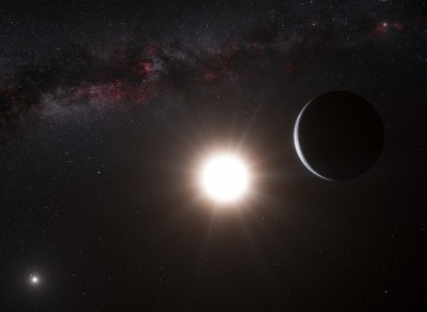 This artist’s impression made available by the European Southern Observatory on Tuesday, Oct. 16, 2012 shows a planet, right, orbiting the star Alpha Centauri B, center, a member of the triple star system that is the closest to Earth.