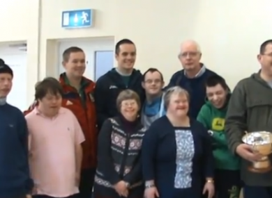 O'Neill poses with the athletes.