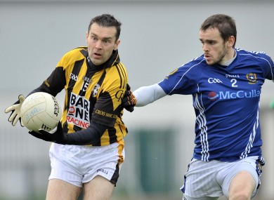 Crossmaglen's Oisin McConville and St Gall's Colin Brady.