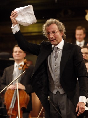 Austrian maestro Franz Welser-Moest conducts the Vienna Philharmonic Orchestra with a cap during a rehearsal for the traditional New Year's concert.