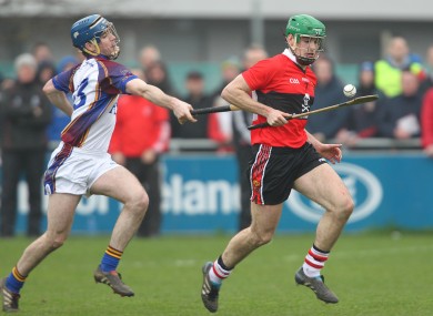 UL's Joe Gallagher and UCC's William Egan in action.