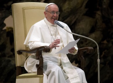 Pope Francis smiles during a meeting with the media at the Vatican this morning