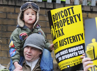 Derek Mac Anucaire and his son Tadhg, 3, from Inchicore at a protest outside the Revenue Computer Centre in Dublin last Saturday.