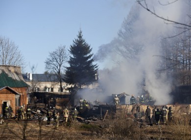 Ministry for Emergency Situations workers and fire fighters work at a site of a fire of a psychiatric hospital Friday morning, April 26, 2013.