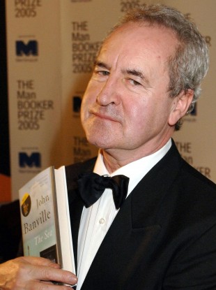 John Banville holds a copy of his book 'The Sea', which won the Man Booker Prize for fiction in 2005 (file photo).