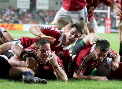 Dan Lydiate celebrates his late score with Conor Murray in support.