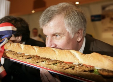 Sehr gut: A former German Agriculture Minister Horst Seehofer horsing into artisan bread at a food fair.