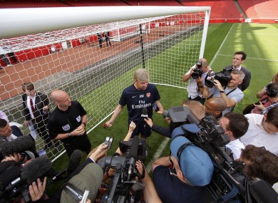 Arsenal manager Arsene Wenger with referee Anthony Taylor during a Goal Line Technology presentation at the Emirates Stadium today.