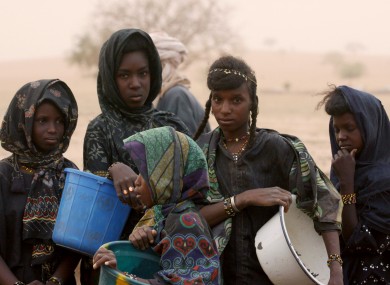 Nomadic Fulani girls wait to collect water from a public well in Gadabeji, Niger.