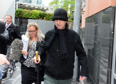 Ray Teret, seen here in black hat, is charged with 32 offences against 15 alleged victims.