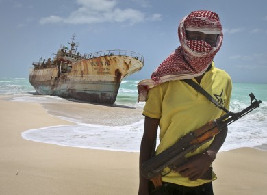 FILE photo of a Somali pirate pictured next to a Taiwanese fishing vessel last year.