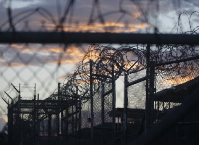 Dawn arrives at the now closed Camp X-Ray