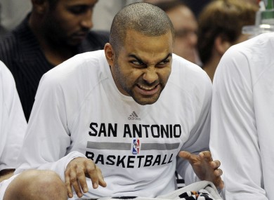 Tony Parker makes faces on the bench during the second half of an NBA preseason game in October.