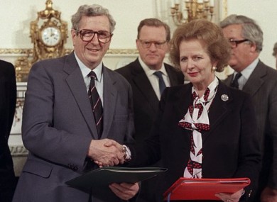 Taoiseach Garret FitzGerald shakes the hand of Britain's Prime Minister Margaret Thatcher after signing the Anglo-Irish agreement.