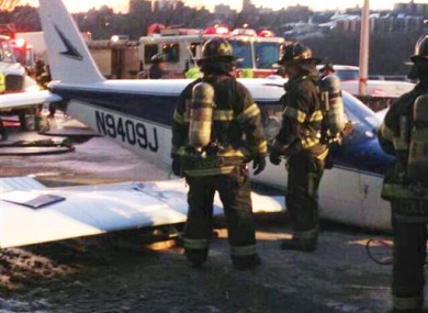 FDNY workers inspect the plane.
