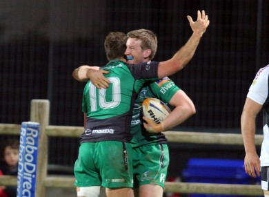 London Irish-bound Eoin Griffin celebrates his try with Dan Parks.
