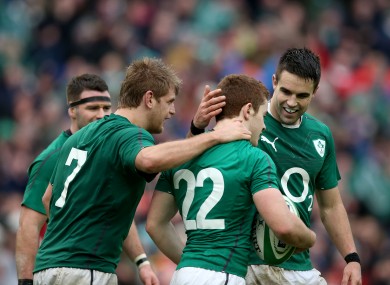 Chris Henry and Conor Murray congratulate Paddy Jackson on his first Ireland try.