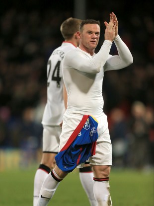 Manchester United's Wayne Rooney applauds the fans after the game.