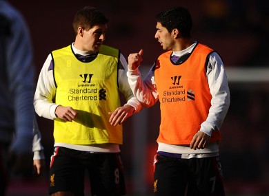 Liverpool's Luis Suarez and Steven Gerrard chat during warm-up.