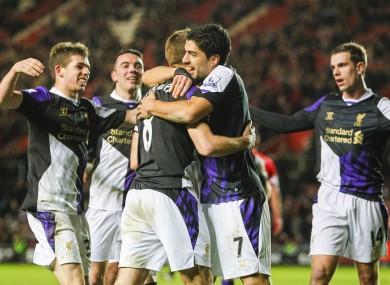 Liverpool's Steven Gerrard (left) celebrates scoring his penalty with team-mate Luis Suarez.