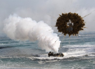 A South Korean marine LVT-7 landing craft sail to shores through a smoke screen during the U.S.-South Korea joint landing exercises called Ssangyong, part of the Foal Eagle military exercises, in Pohang, South Korea.