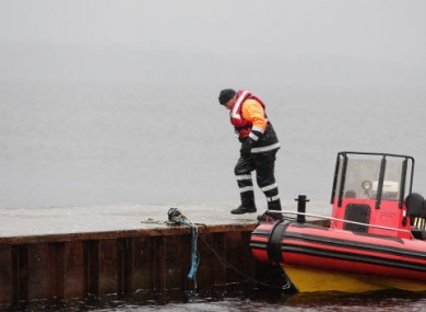 A member of the Civil Defence returns to shore.