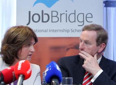 Enda Kenny and Joan Burton at last year's review of the scheme.