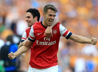 Arsenal's Aaron Ramsey (right) celebrates with team-mate Mikel Arteta after the game.