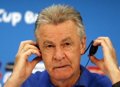 Switzerland's coach Ottmar Hitzfeld adjusts his earphone during a press conference at the Arena da Amazonia in Manaus.