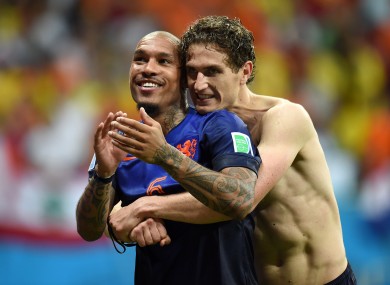 Netherlands' Nigel de Jong (left) and Daryl Janmaat celebrate after the game.
