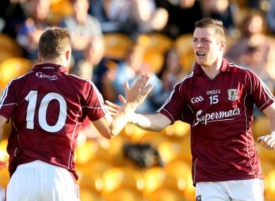 Galway's Danny Cummins celebrates scoring his side's third goal with Michael Lundy.