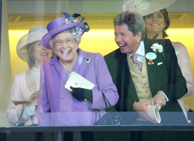 Queen Elizabeth II with her racing manager John Warren after her horse, Estimate, won the Gold Cup on day three of the Royal Ascot.