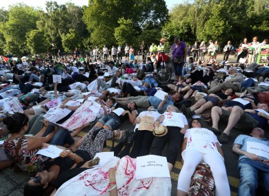 Hundreds of protesters lie down in front of the Department of Foreign Affairs in Dublin this evening.