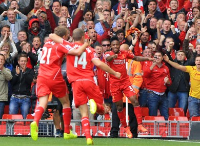 Raheem Sterling celebrates scoring his side's first goal.